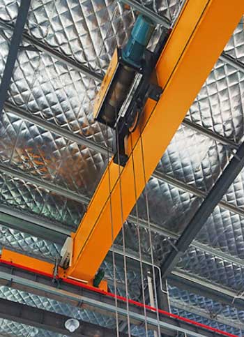 Low headroom hoists and cranes for space consstraint environment 
