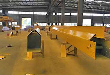 Main girder of the overhead crane is cut into two sections for the sake of shipping by containers. 