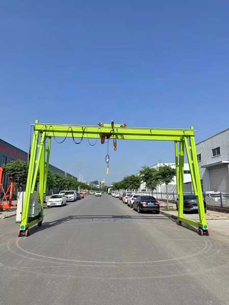 Electric battery powered rolling gantry crane with a frame design and 360 rotating wheels for limisted space and workshops 