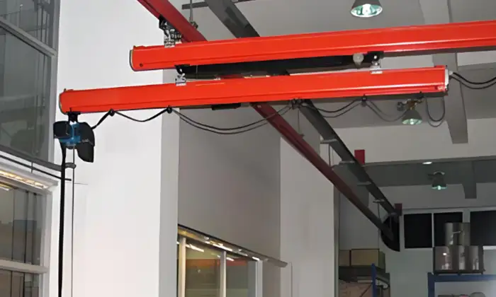 Telescoping crane with sliding cantilever for limited and obstructed space 