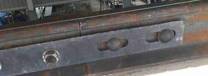 Crane rail clamp plate with bolts to connect the two rails